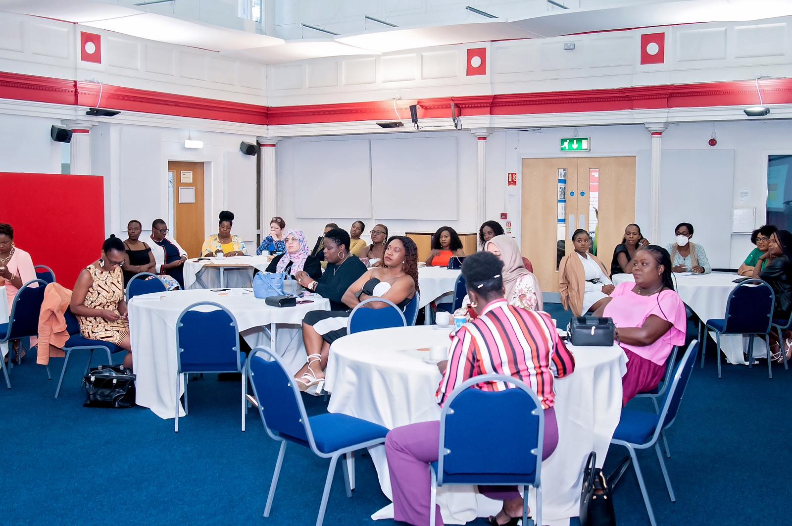 Women listening and sharing at a Woman Arise event