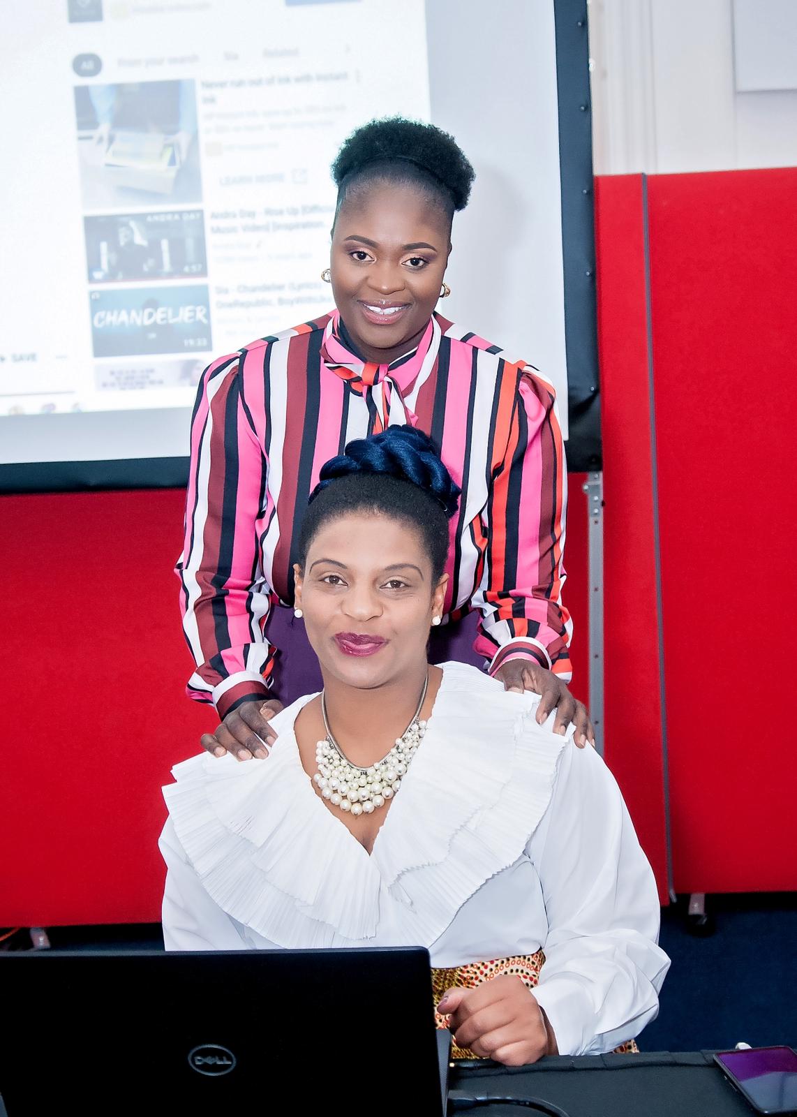 Two women taking part in a Woman Arise event