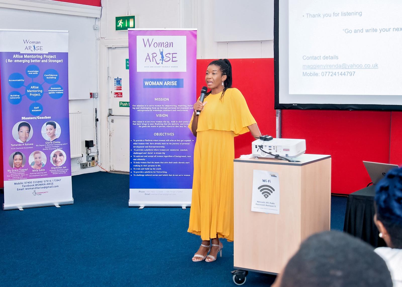 A speaker sharing her experience at a Woman Arise gathering